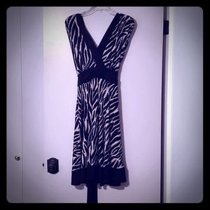 Striking black and tan dress with V neck and back